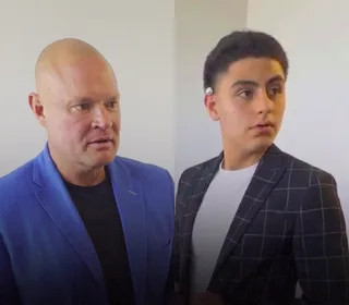 Shawn has a conversation with a client indoors.